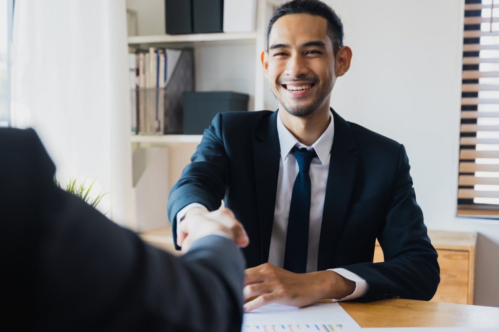 pexels-photo-12885861 successful negotiate and handshake concept, two businessman shake hand with partner to celebration partnership and teamwork, business deal