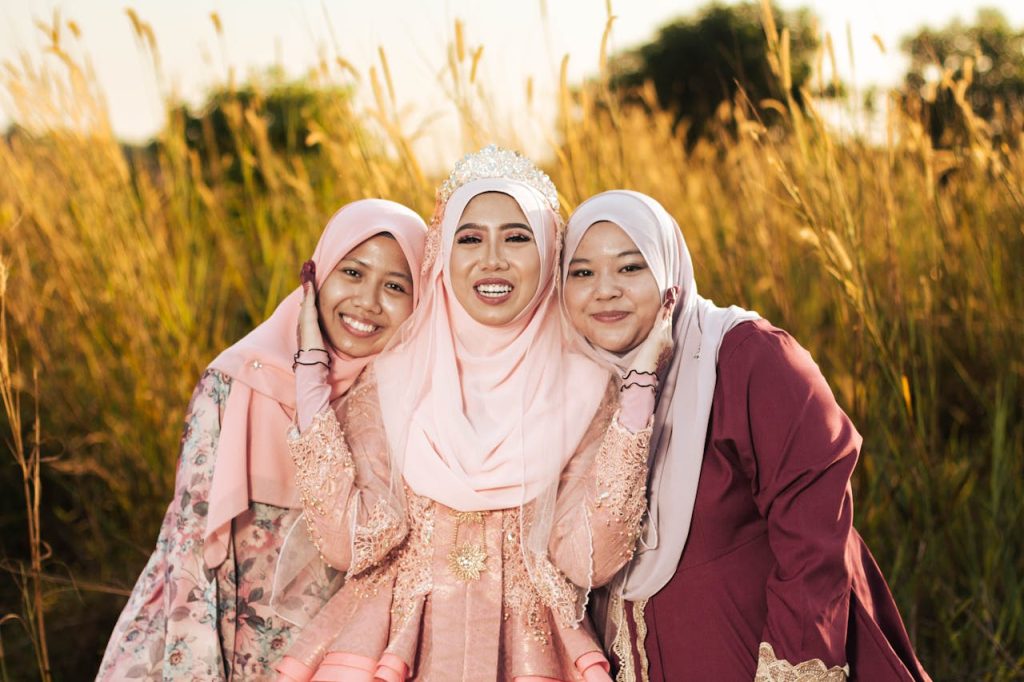 pexels-photo-12909010 Women in Pink Hijab Smiling